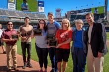 Members of PeaceMaker partner schools experiencing who demonstrated the sharpest decline in bullying rates are honored at a Twings game